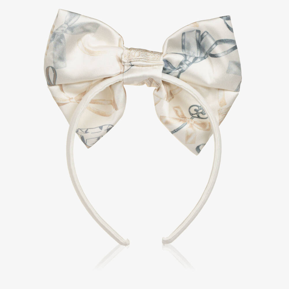 A Dee-Girls Ivory Bow Hairband with a Perfume Bottle Print | Childrensalon