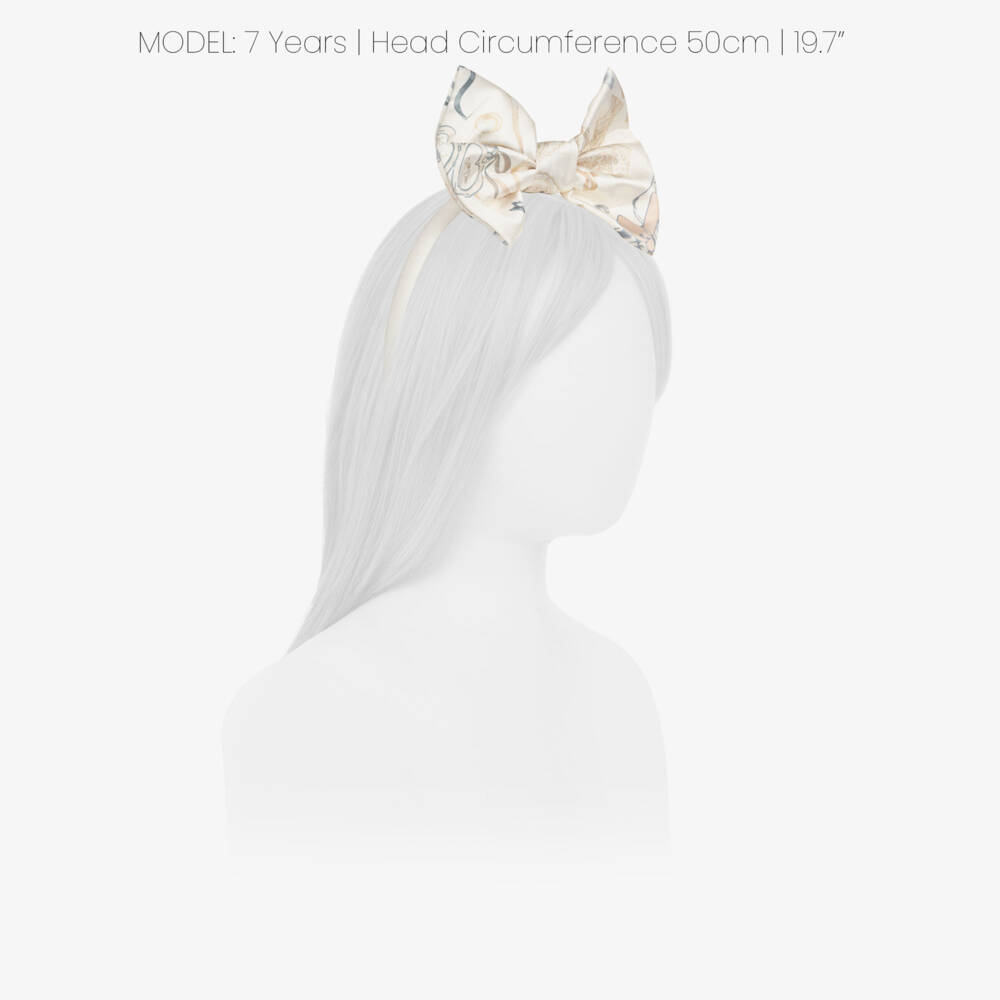 A Dee-Girls Ivory Bow Hairband with a Perfume Bottle Print | Childrensalon