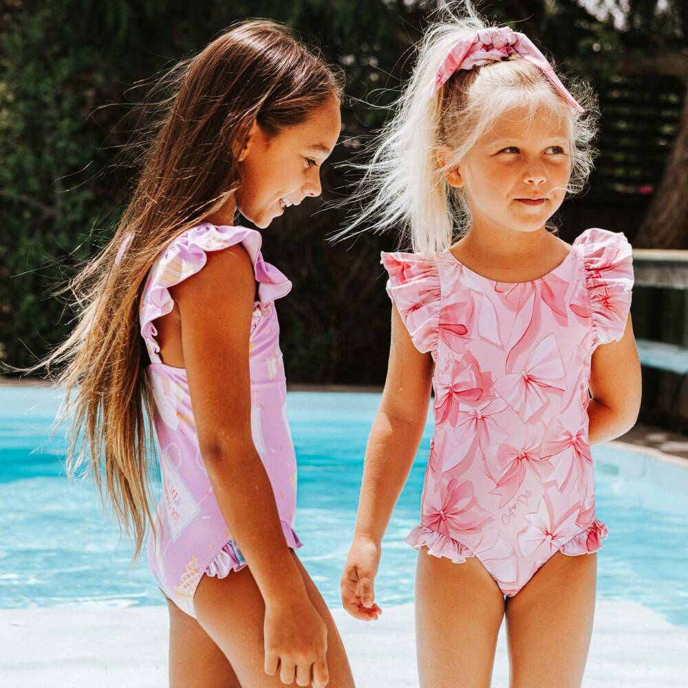 A Dee-Girls Pale Pink Swimsuit with Bow Print | Childrensalon