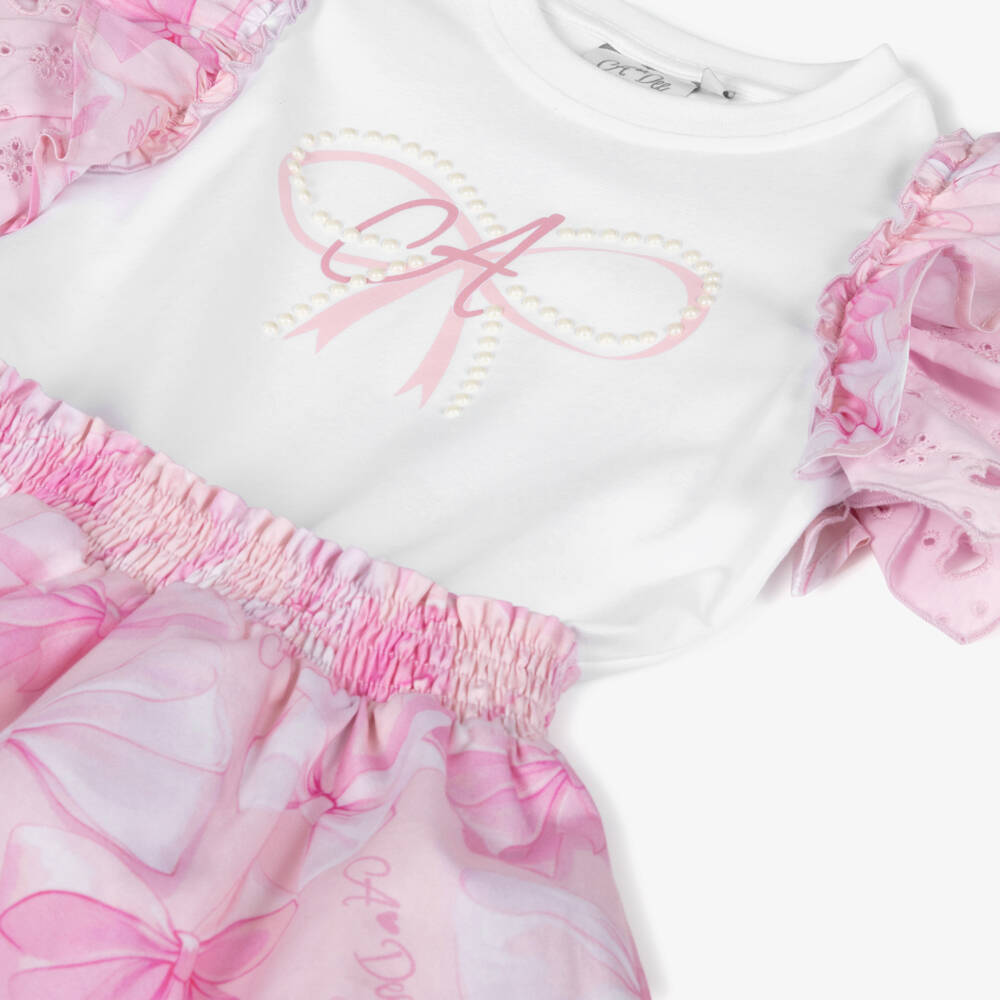A Dee-Girls Pink Cotton Bow Dress with Broderie Anglaise Trims | Childrensalon
