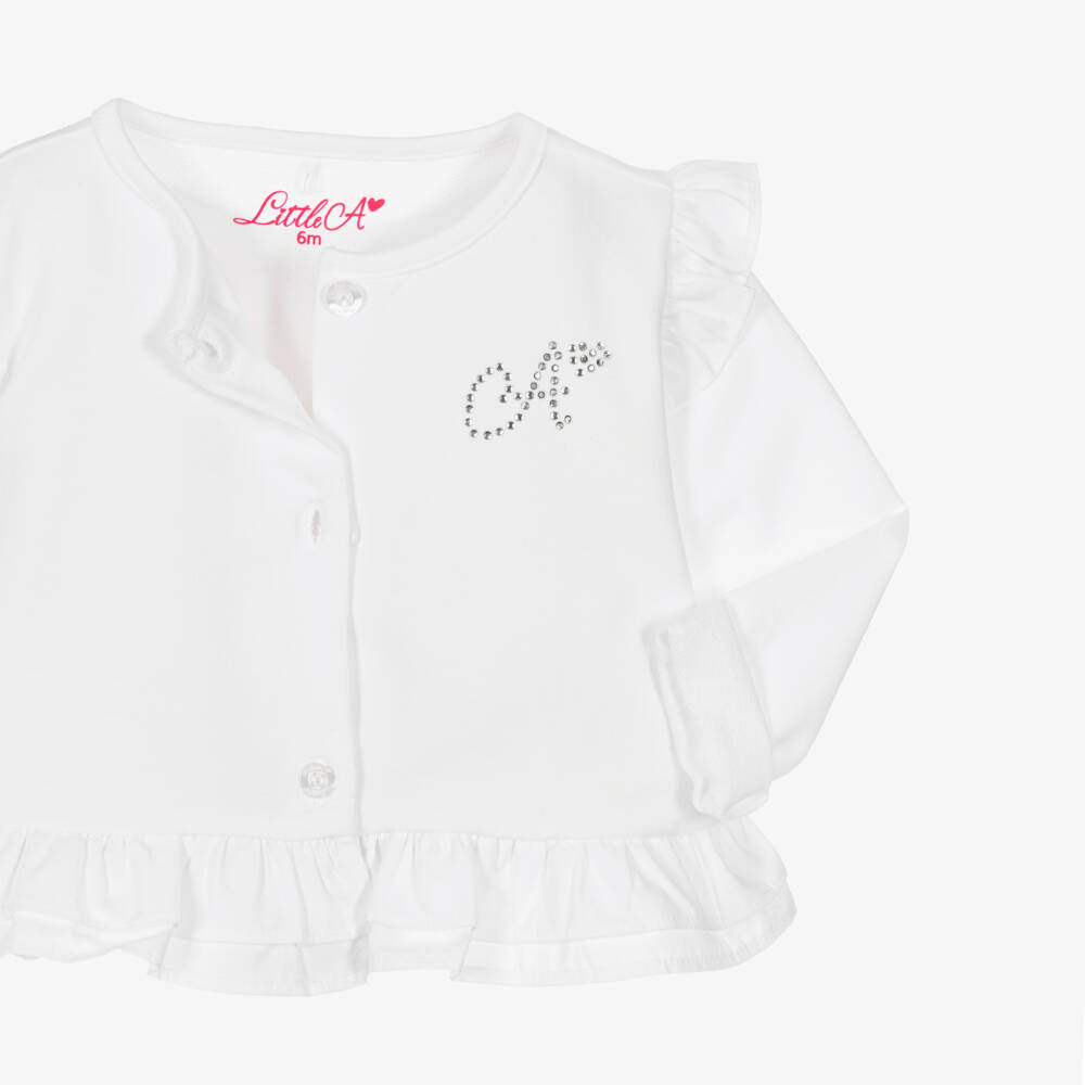 A Dee-Girls White Cotton Frill Cardigan with Diamanté Logo | Childrensalon