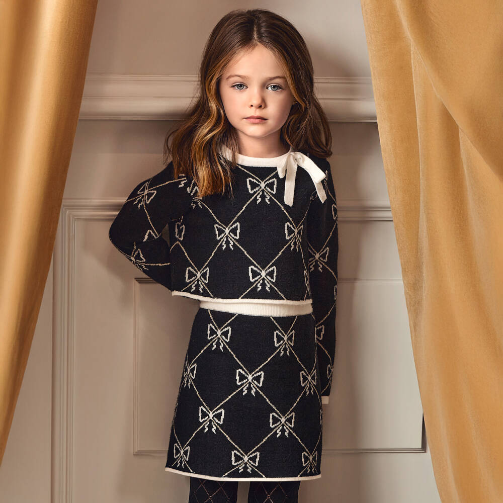Abel & Lula-Girls Black Knitted Skirt Set with Bow Pattern | Childrensalon