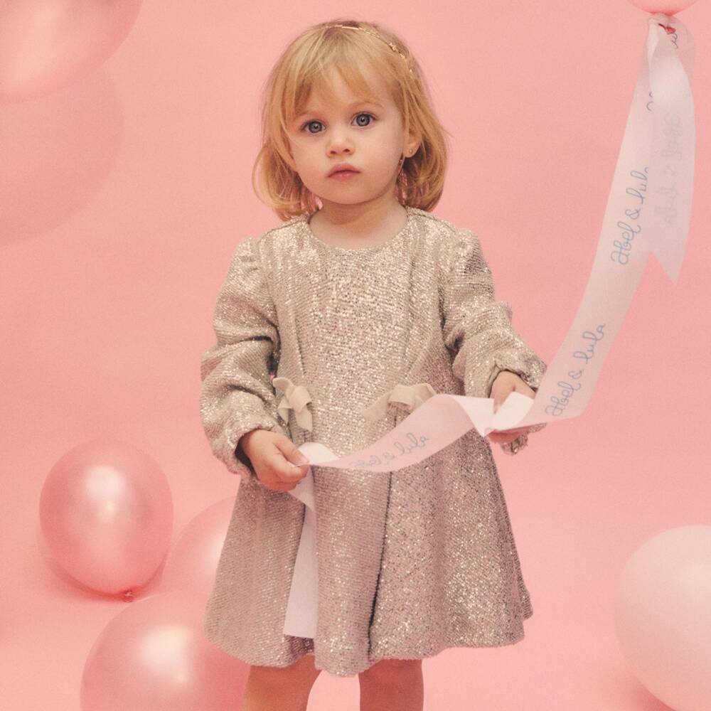 Abel & Lula-Girls Glittery Gold Pleated Dress with Bows | Childrensalon