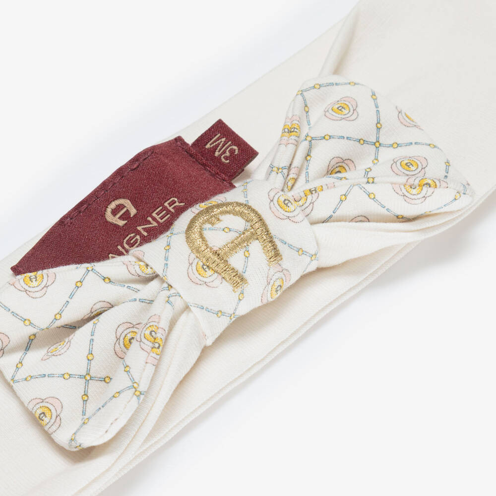 AIGNER-Baby Girls Ivory Bow Headband with Gold Logo Embroidery | Childrensalon