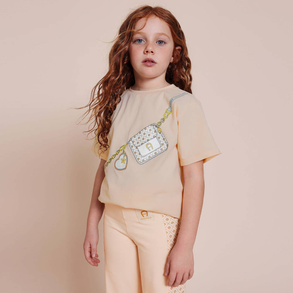 AIGNER-تيشيرت بطبعة حقيبة قطن لون برتقالي فاتح للبنات | Childrensalon