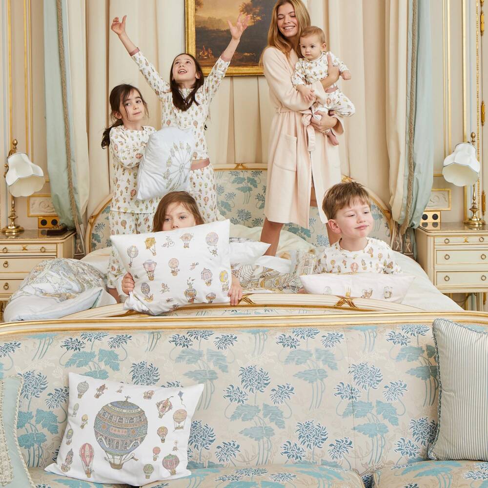 Atelier Choux Paris-Ivory Cotton Sateen Cushion with Blue Hot Air Balloons (42cm) | Childrensalon