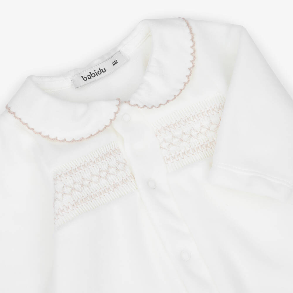 Babidu-Ivory Velour Babygrow with Smocking | Childrensalon