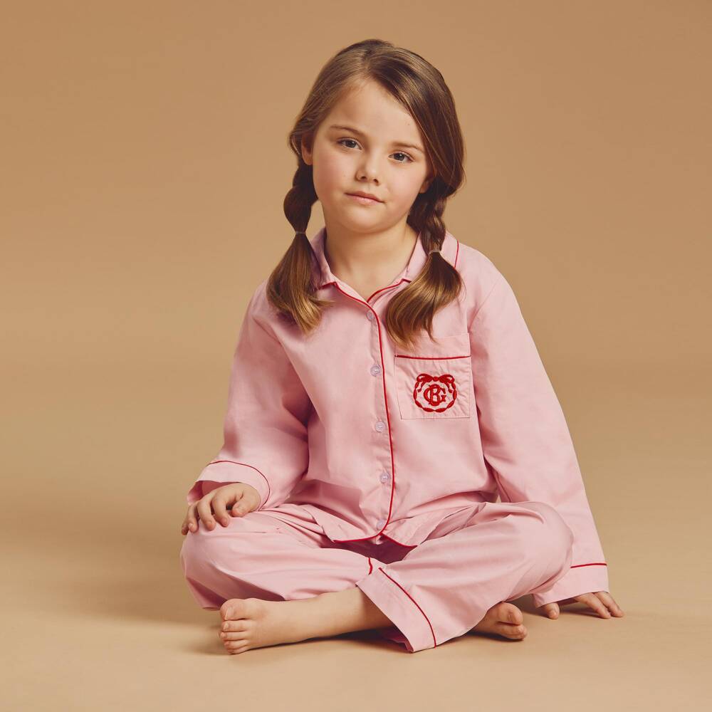 Beatrice & George-Pink Cotton Pyjamas with Red Piping | Childrensalon
