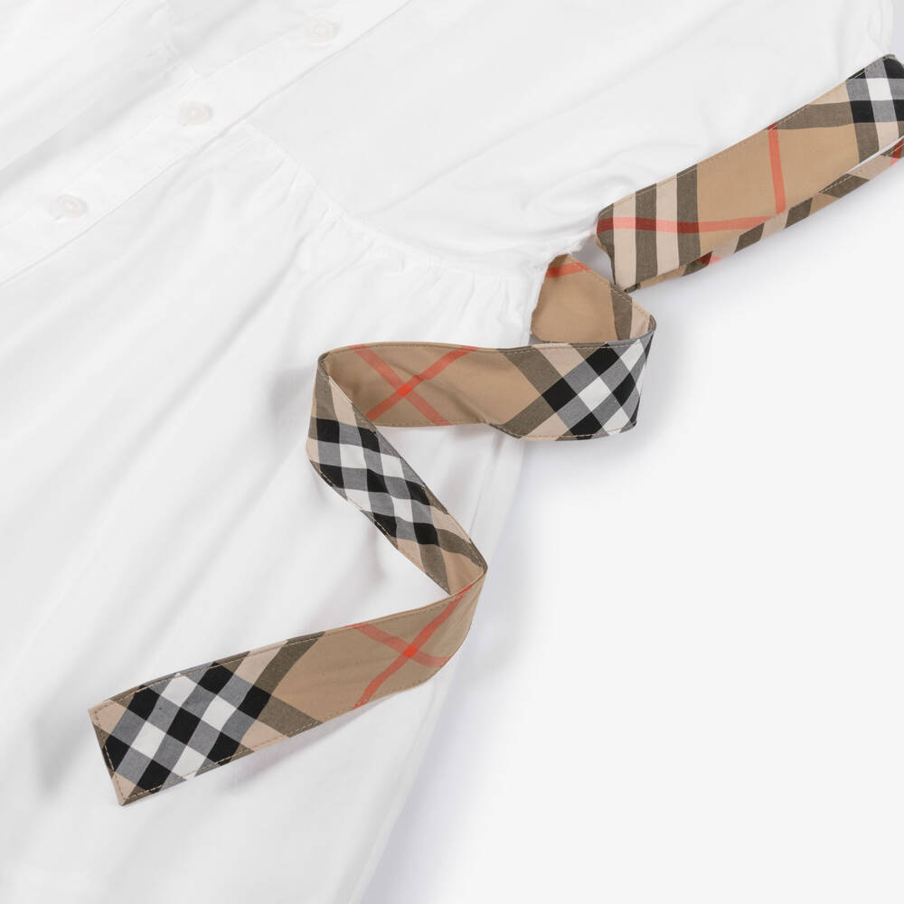 Burberry-فستان قطن بتصميم قميص وتفاصيل كاروهات لون أببيض للبنات | Childrensalon
