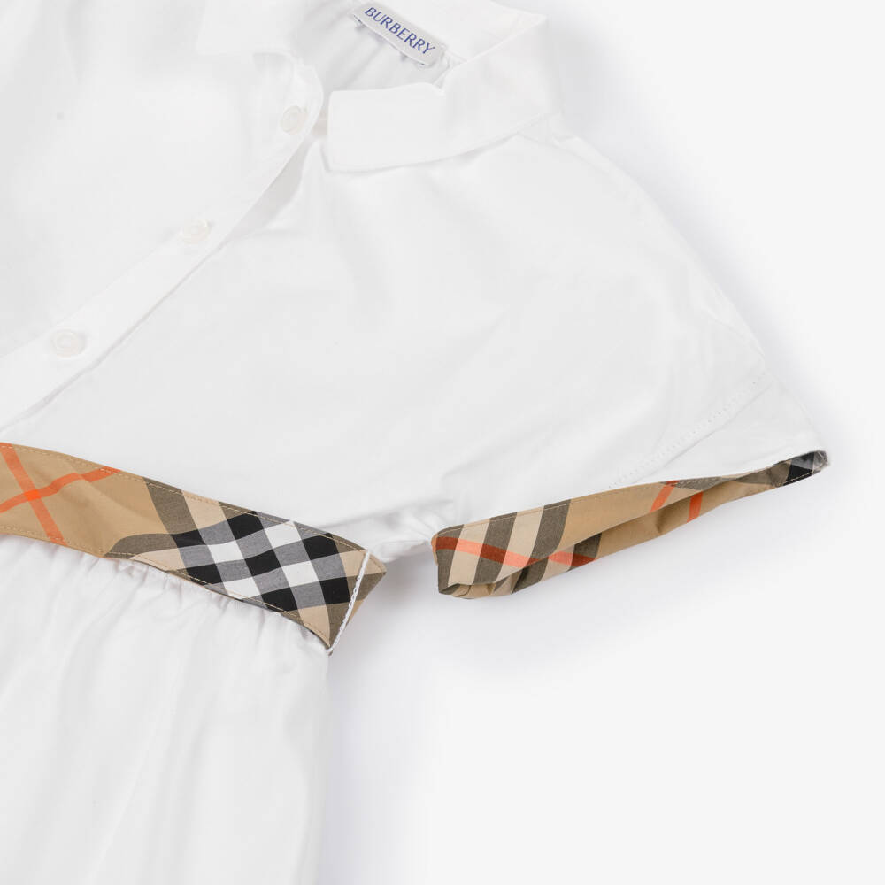 Burberry-فستان قطن بتصميم قميص وتفاصيل كاروهات لون أببيض للبنات | Childrensalon