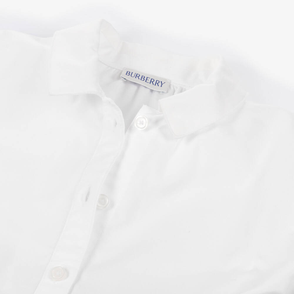 Burberry-فستان قطن بتصميم قميص وتفاصيل كاروهات لون أببيض للبنات | Childrensalon