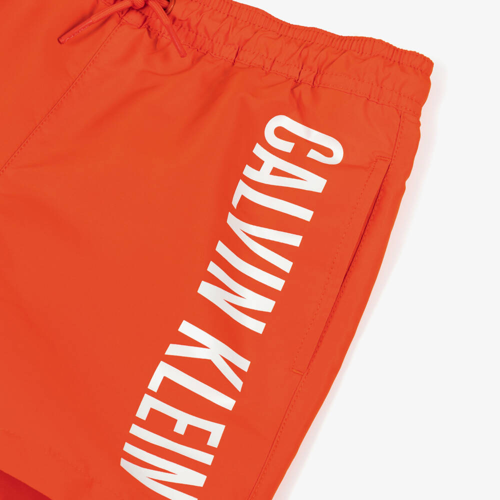 Calvin Klein-Boys Orange & White Logo Swim Shorts | Childrensalon