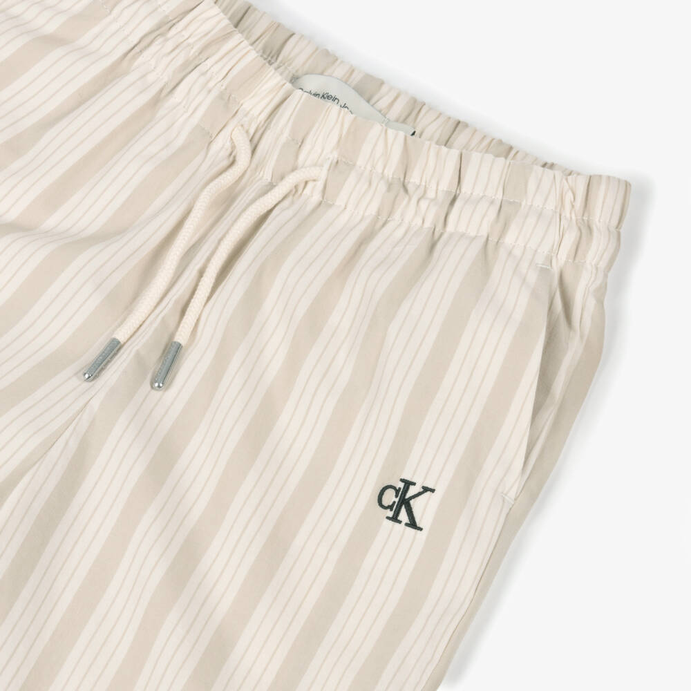 Calvin Klein-Girls Beige Striped Cotton Trousers | Childrensalon