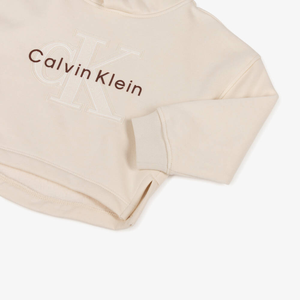 Calvin Klein-Худи кремовое хлопковое с мерцающей монограммой CK для девочек | Childrensalon