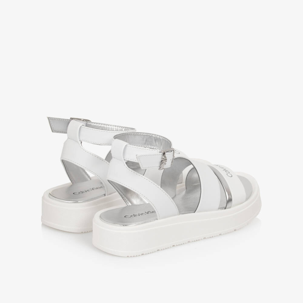 Calvin Klein-Girls White Faux Leather Sandals with Silver Trims | Childrensalon