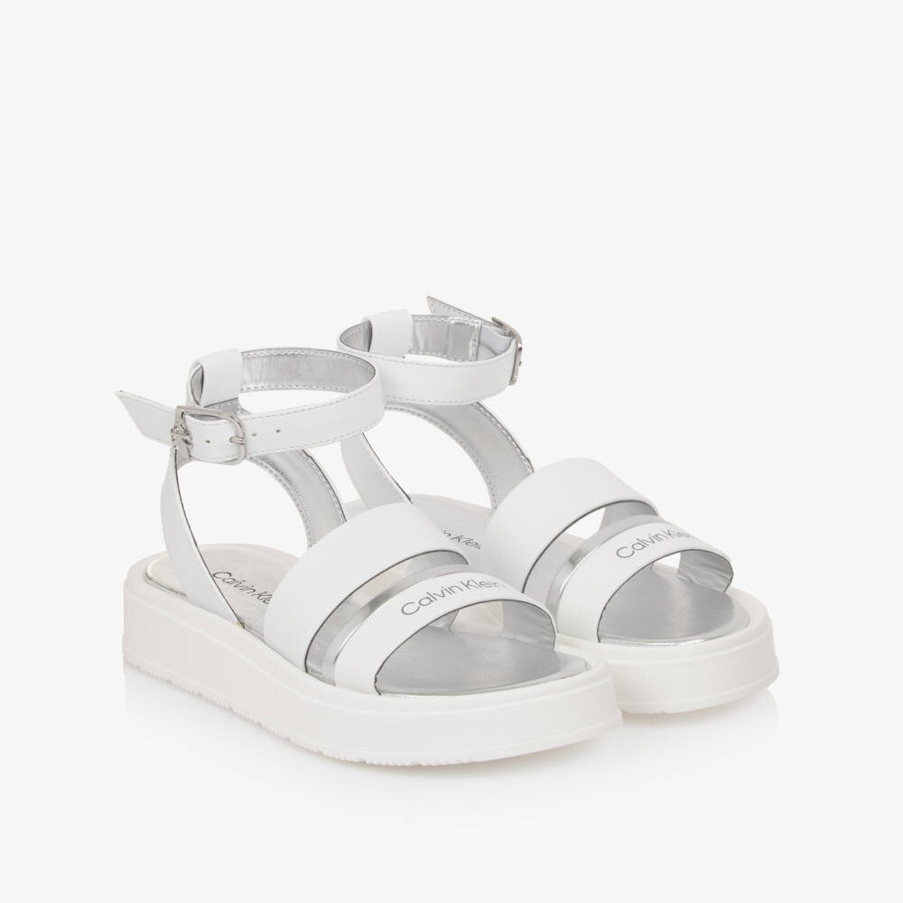 Calvin Klein-Girls White Faux Leather Sandals with Silver Trims | Childrensalon