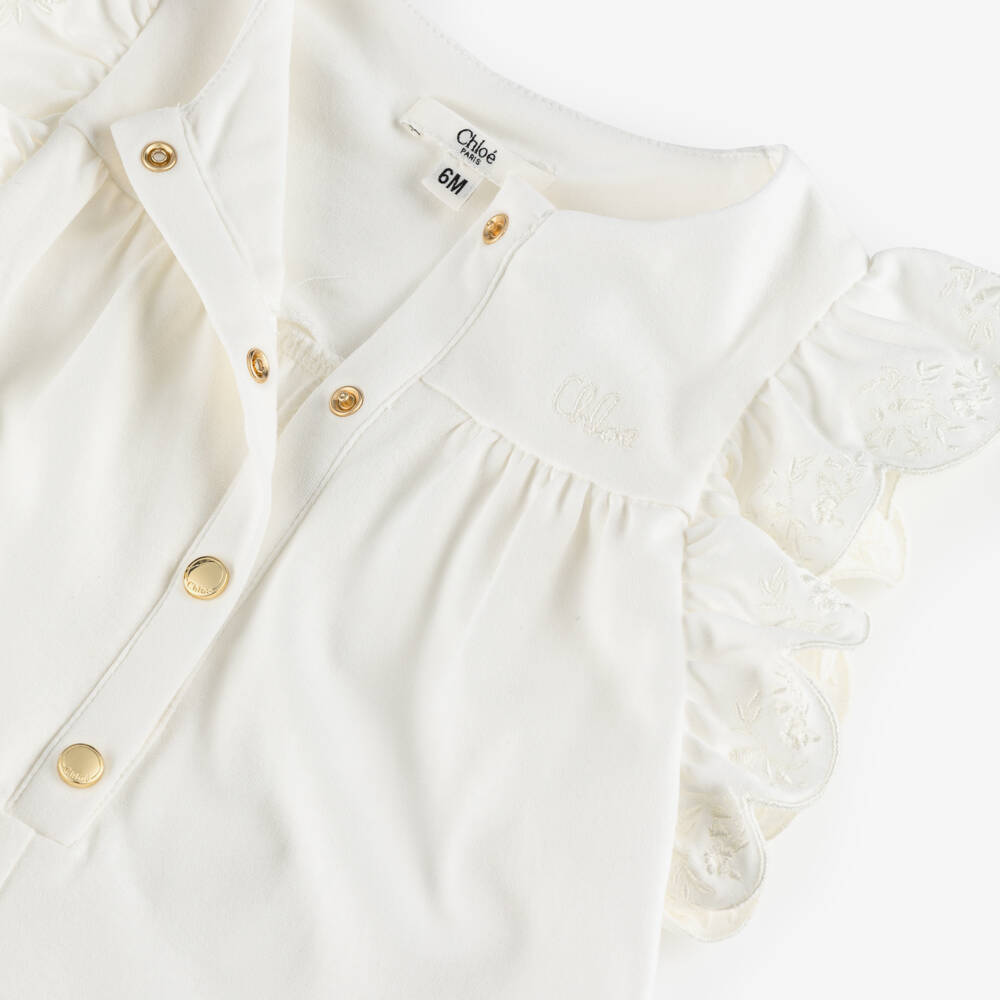 Chloé-Girls White Cotton Ruffle Sleeve Playsuit | Childrensalon