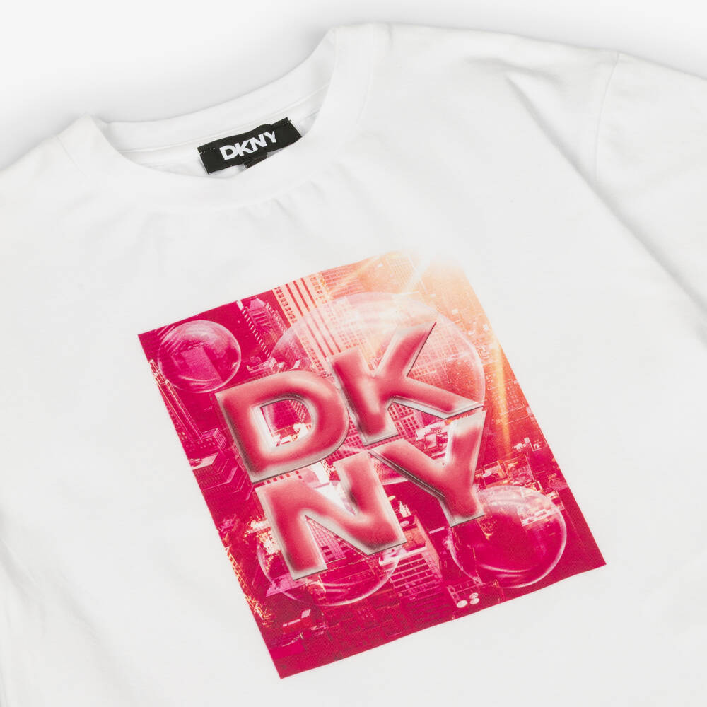 DKNY-Girls White Cotton Jersey T-Shirt with Pink City Graphic | Childrensalon