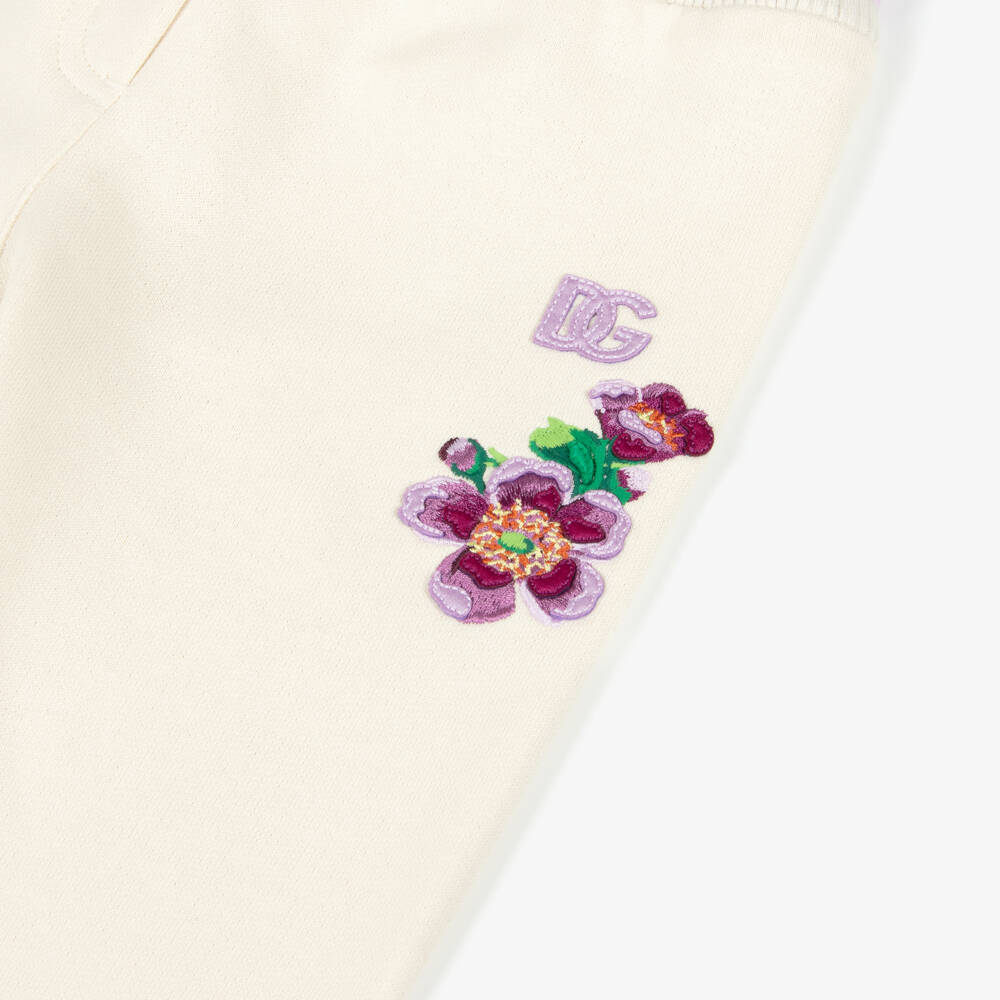 Dolce & Gabbana-Baby Girls Ivory Cotton Joggers with Purple Floral Detailing | Childrensalon