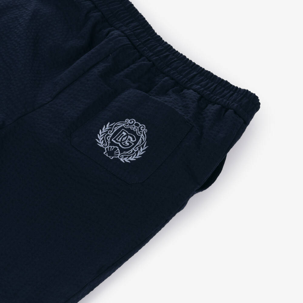 Dolce & Gabbana-Шорты синие из хлопкового сирсакера с гербом для мальчиков | Childrensalon