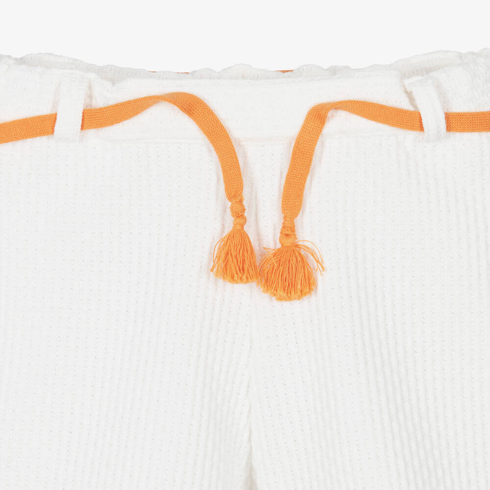 Dr. Kid-Girls Ivory Cotton Knit Shorts with Orange Tassel Belt | Childrensalon