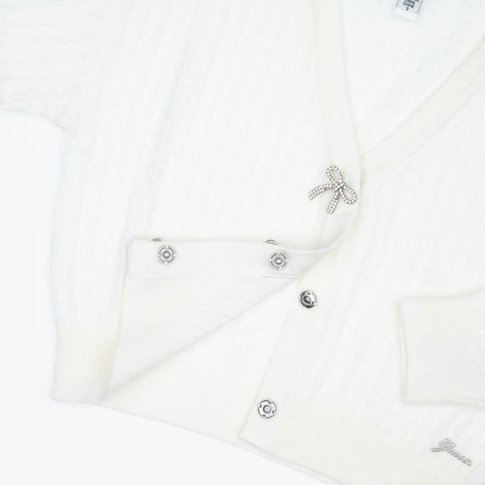 Guess-كارديغان محبوك مزين بفيونكات كريستال لون عاجي للبنات | Childrensalon