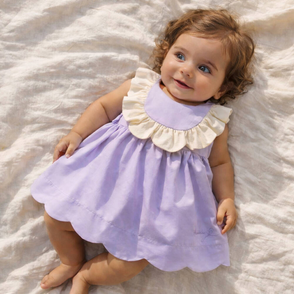 Hucklebones London-Baby Girls Lavender Dress with Ivory Ruffle Trim | Childrensalon