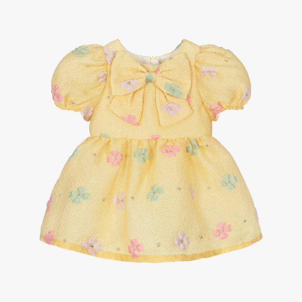 Hucklebones London-Платье жёлтое жаккардовое с цветами и бантом для малышек | Childrensalon
