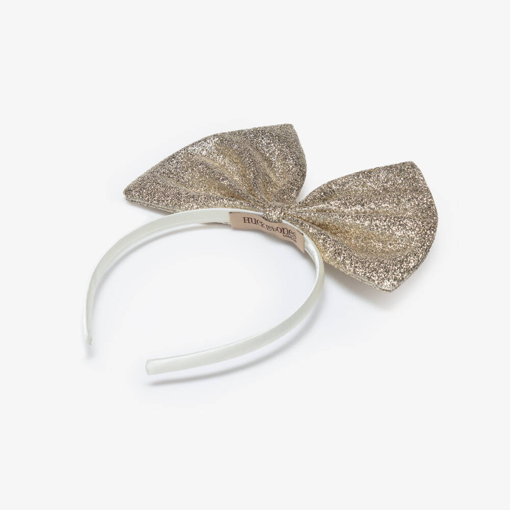 Hucklebones London-Girls Glittery Gold Bow Hairband | Childrensalon