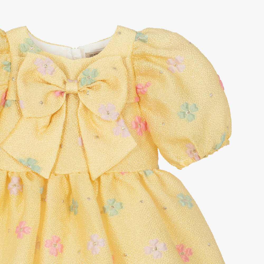Hucklebones London-Платье с бантом желтое цветочное жаккардовое для девочек | Childrensalon