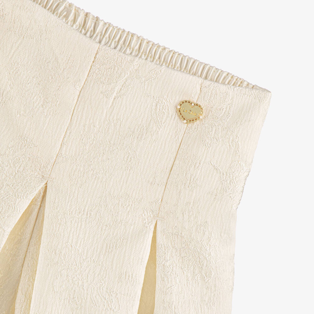 Le Chic-Girls Ivory Floral Jacquard Pleated Shorts | Childrensalon