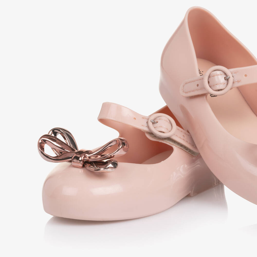 Mini Melissa-Girls Pink Jelly Pumps with Rose Gold Bow | Childrensalon