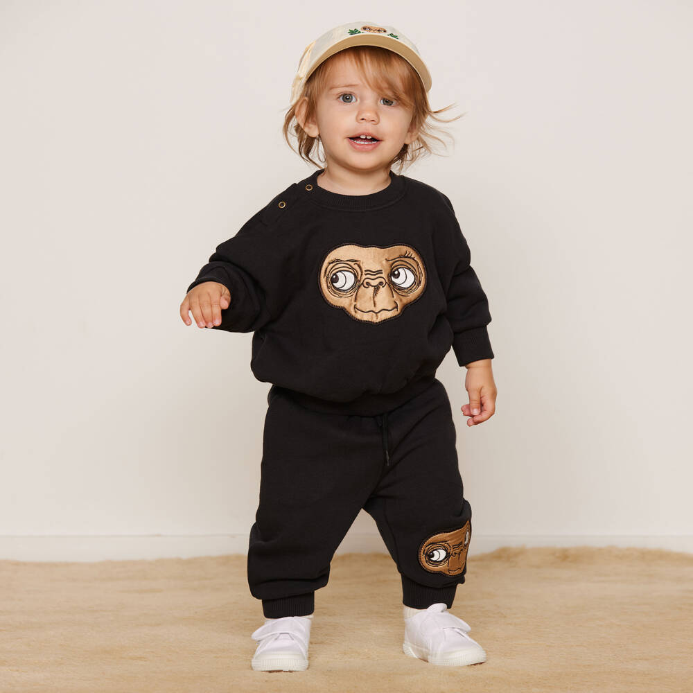 Mini Rodini-Джоггеры черные хлопковые с коричневой атласной аппликацией E.T. | Childrensalon