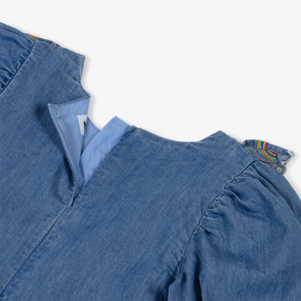 Molo-Girls Blue Chambray Ruffle Dress with Rainbow Embroidery | Childrensalon