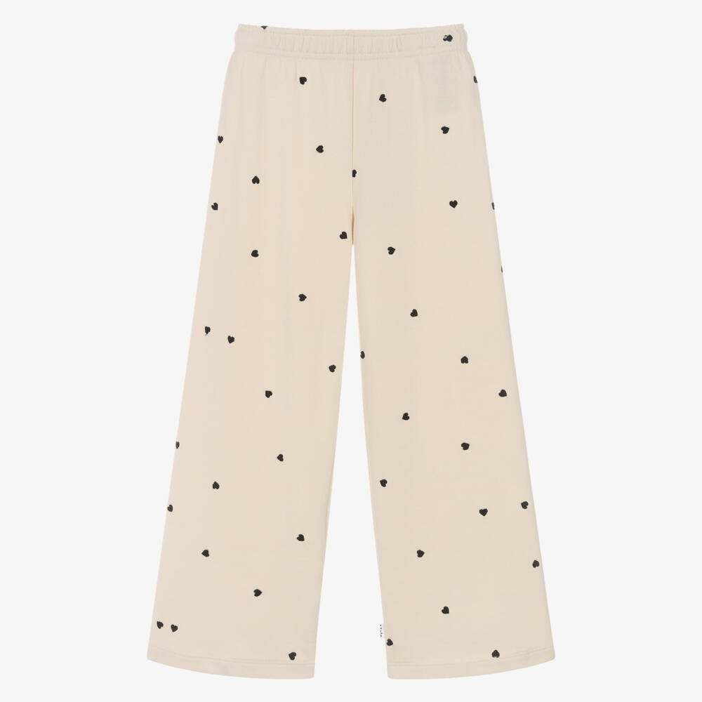 Molo-Джоггеры хлопковые кремовые с черной вышивкой сердец для девочек | Childrensalon