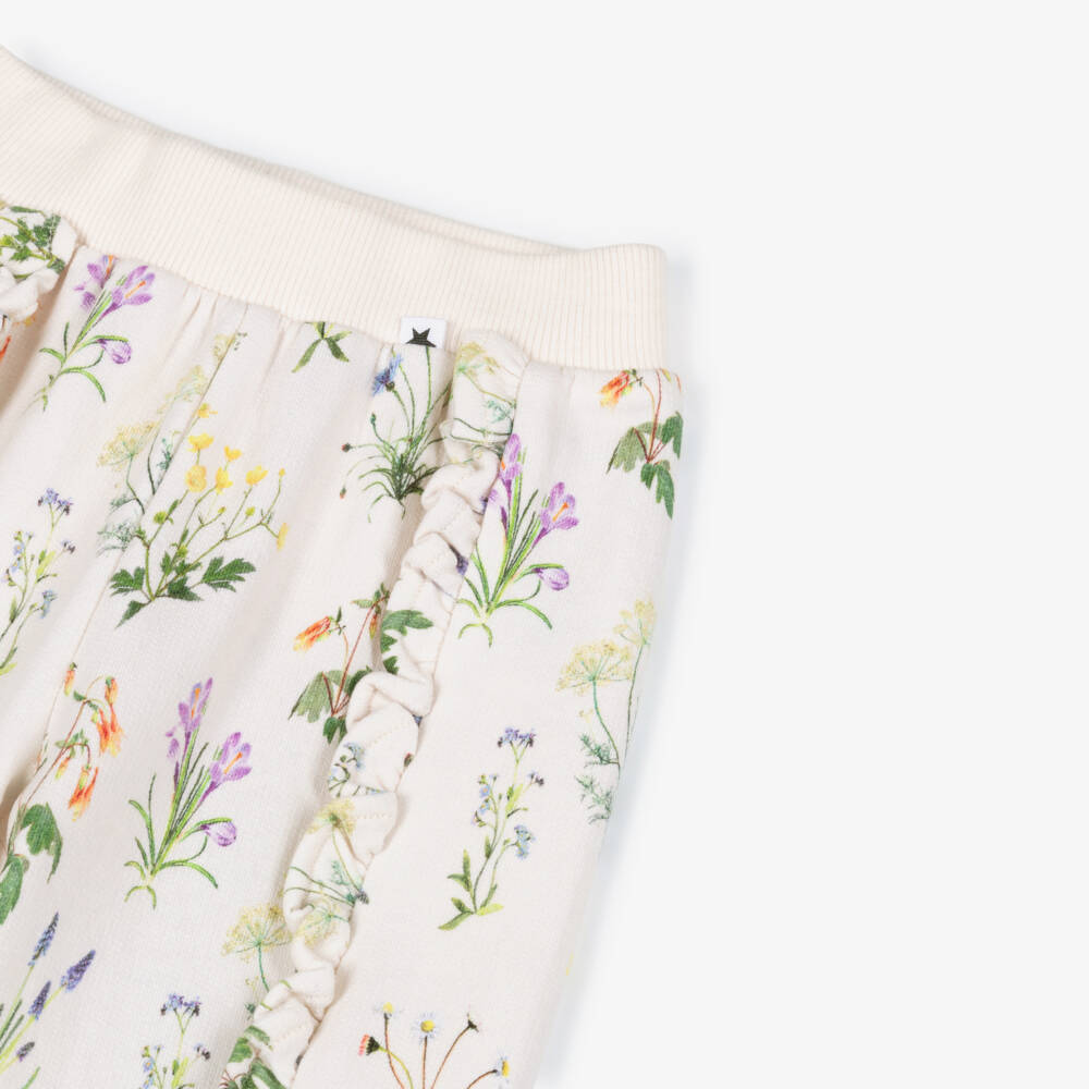 Molo-Girls Ivory Organic Cotton Floral Joggers with Ruffles | Childrensalon