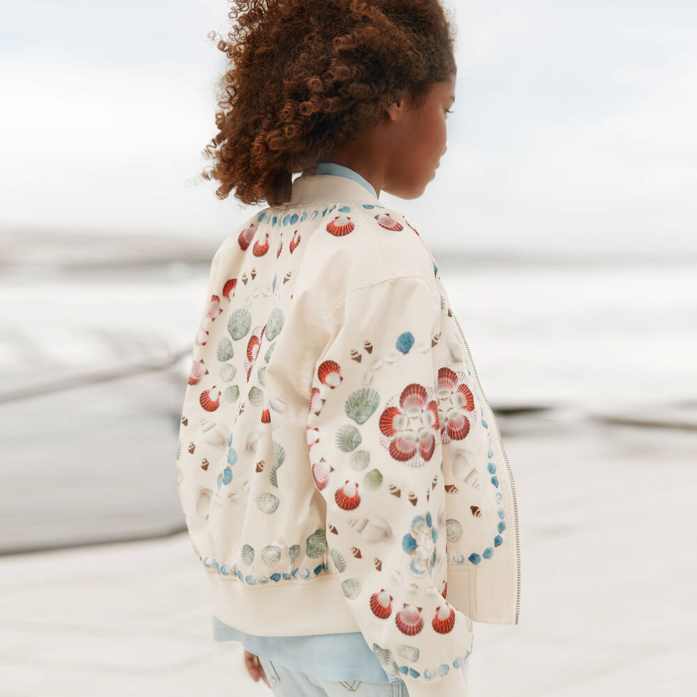 Molo-Girls Silky Ivory Bomber Jacket with Shell Print | Childrensalon