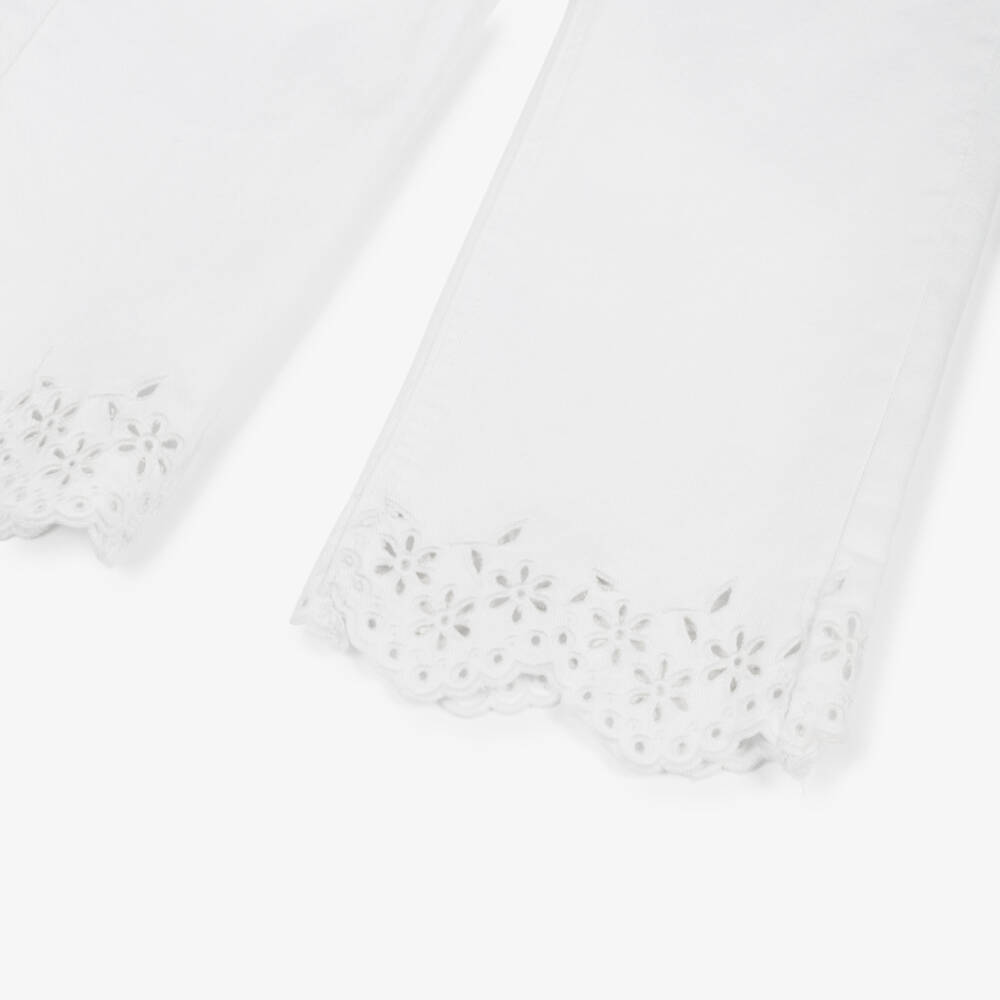 Molo-Girls White Denim Jeans with Broderie Anglaise Trims | Childrensalon