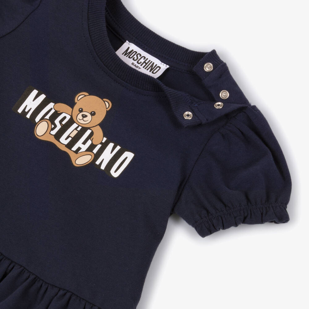 Moschino-Baby Girls Blue Cotton Jersey Teddy Bear Logo Dress | Childrensalon