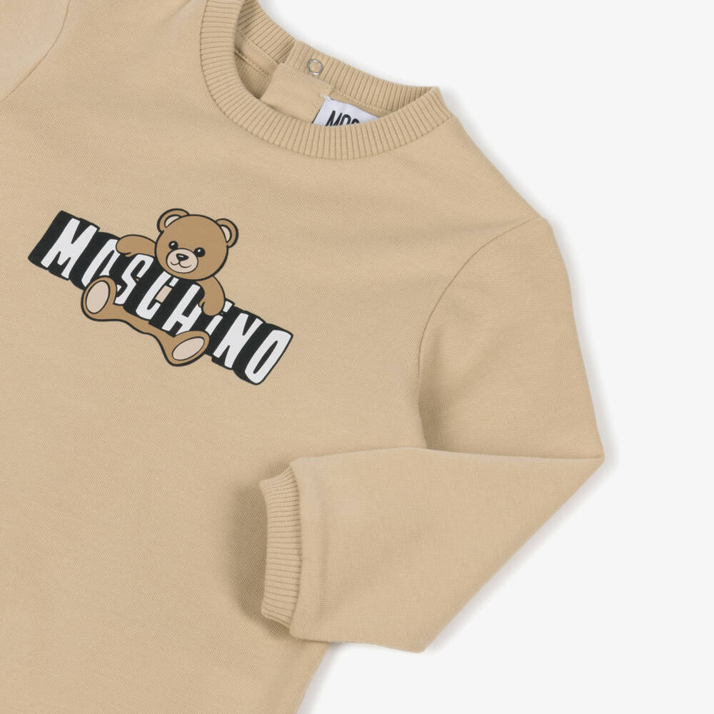 Moschino-Beige Cotton Babygrow with Teddy Bear Logo | Childrensalon