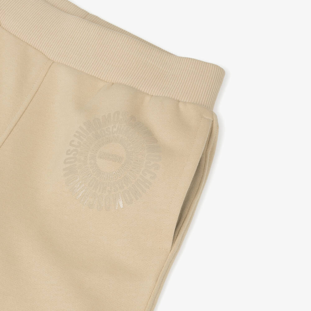 Moschino-بدلة رياضية بطبعة شعار قطن لون بيج | Childrensalon