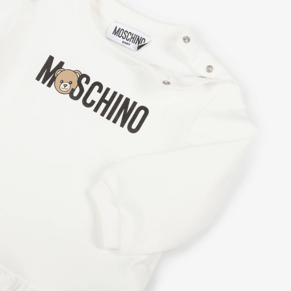 Moschino-فستان بشعار الدب تيدي قطن لون عاجي للبنات الرضع | Childrensalon