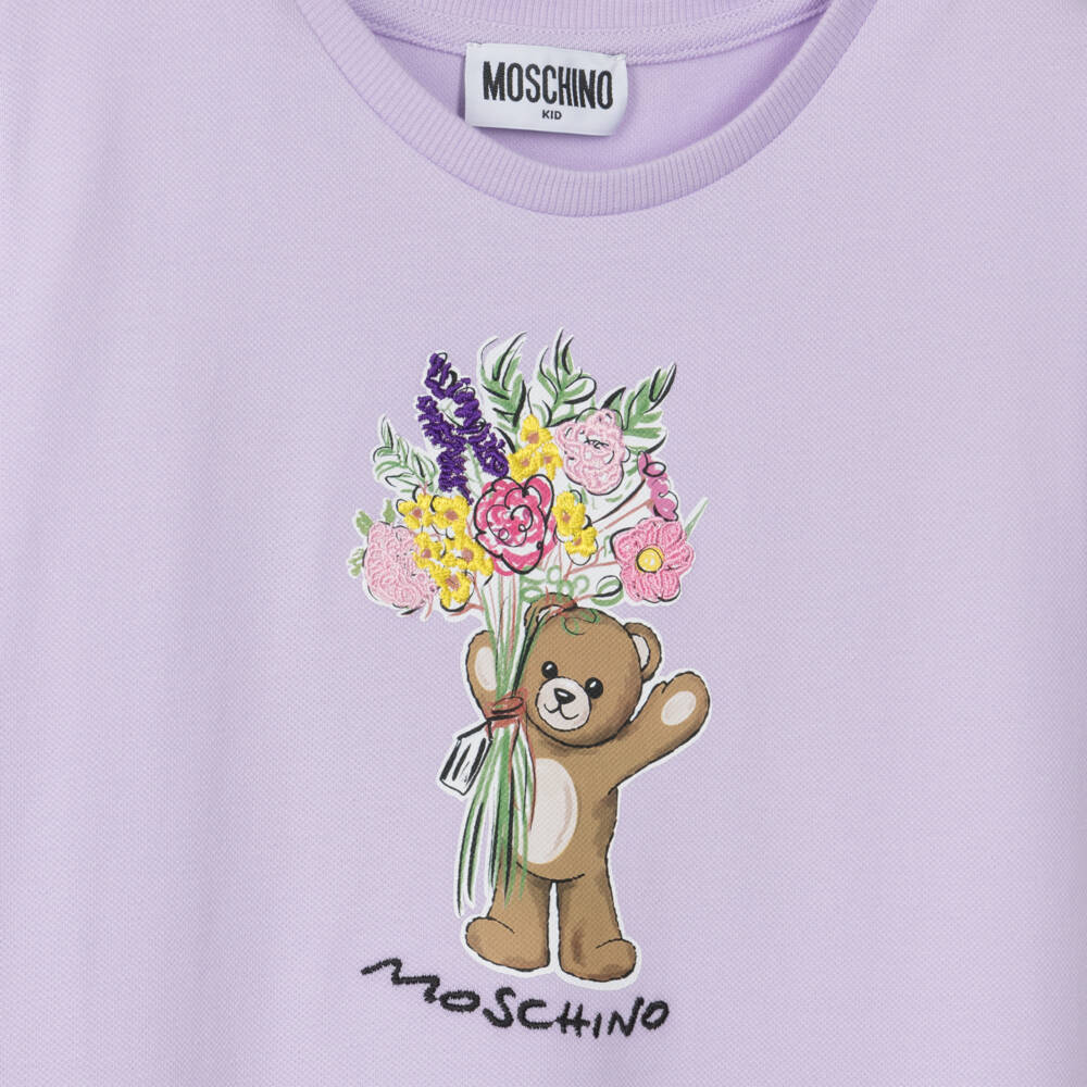 Moschino-Girls Lilac Purple Cotton Piqué Teddy Bear Motif Dress | Childrensalon