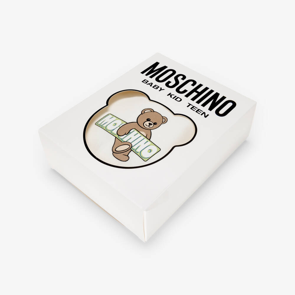 Moschino-أفرول بيبي غرو بشعار الدب تيدي قطن لون عاجي | Childrensalon