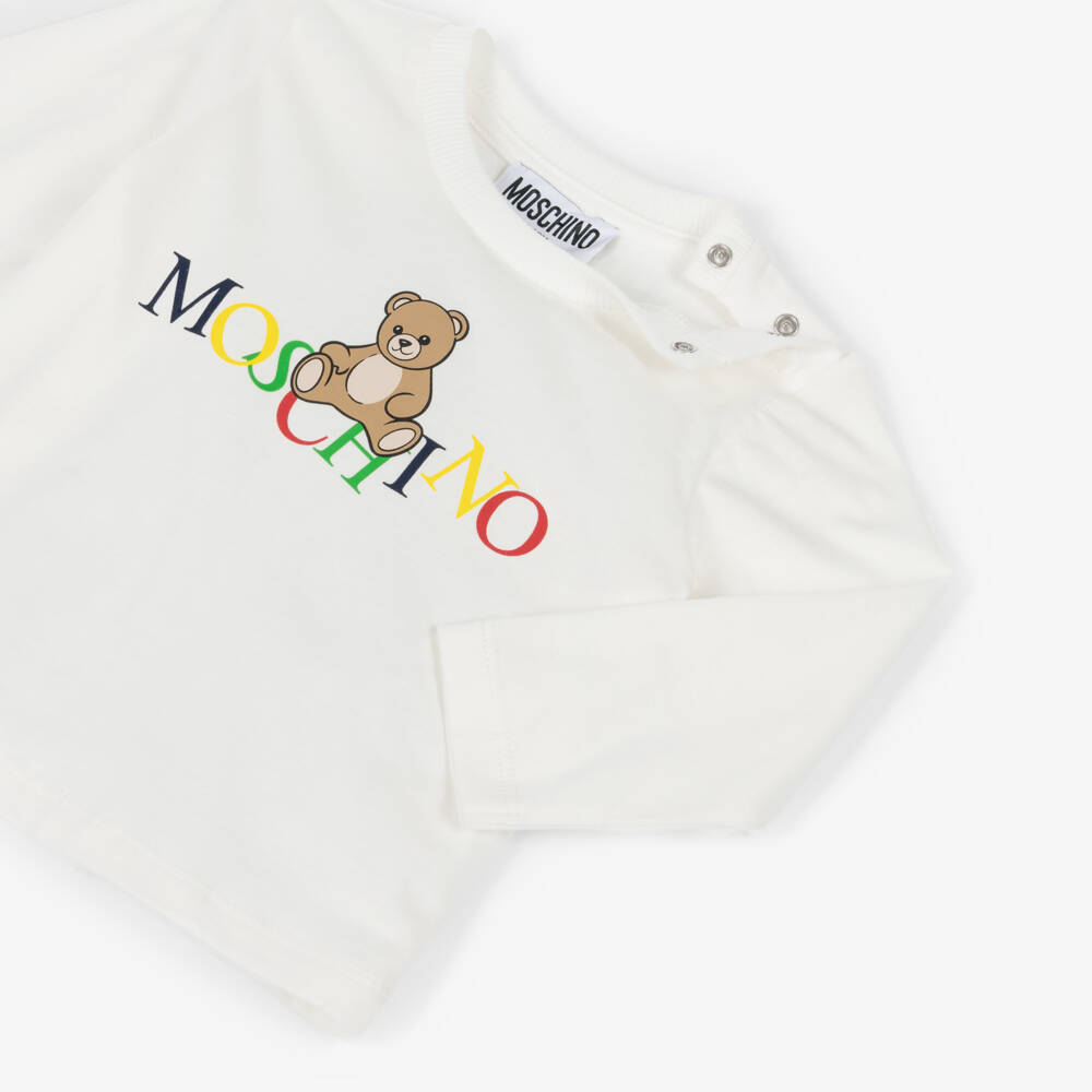 Moschino-Ivory Cotton Teddy Bear Top with Colourful Logo | Childrensalon