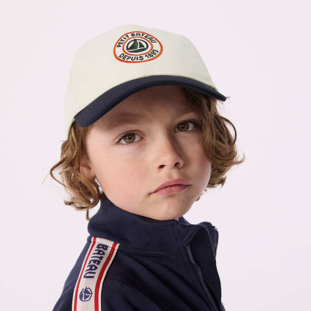 Petit Bateau-Boys Ivory Cotton Twill Cap with Navy Blue Peak | Childrensalon