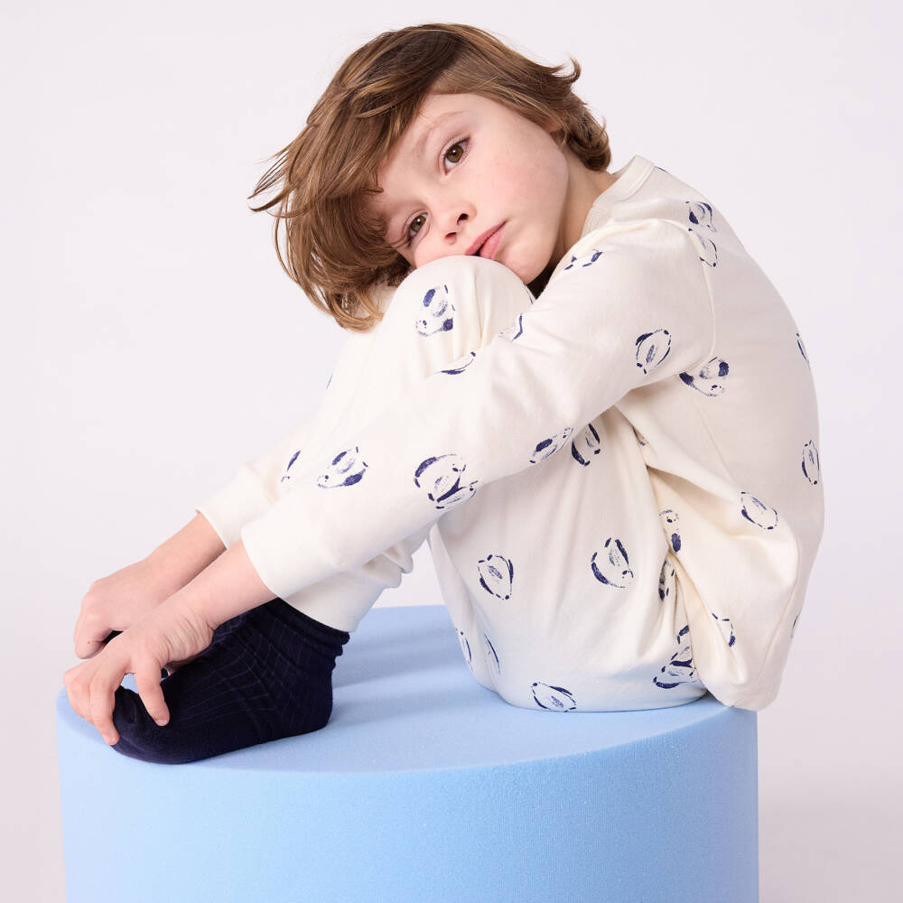 Petit Bateau-Ivory Cotton Pyjamas with Navy Blue Penguin Print | Childrensalon