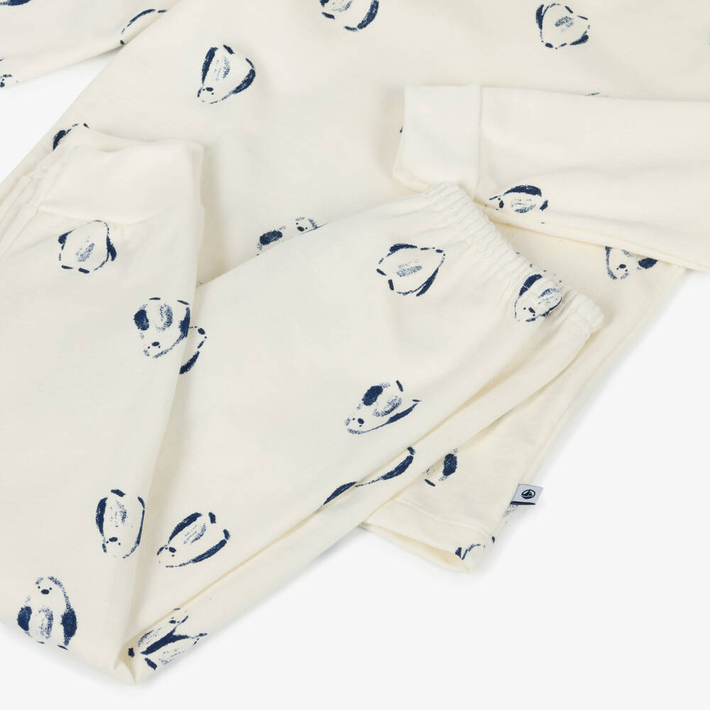 Petit Bateau-Ivory Cotton Pyjamas with Navy Blue Penguin Print | Childrensalon