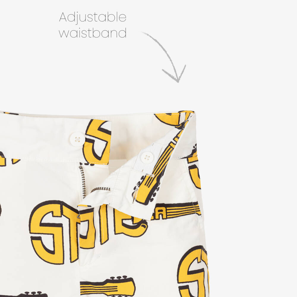 Stella McCartney Kids-Шорты кремовые хлопковые с жёлтыми гитарами для мальчиков | Childrensalon