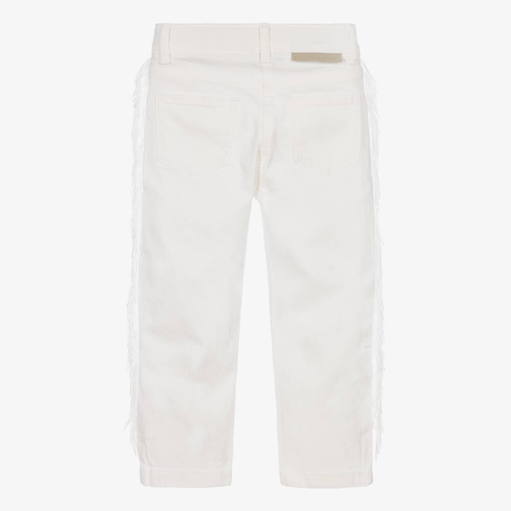 Stella McCartney Kids-Girls Ivory Denim Jeans with Fringe Trims | Childrensalon
